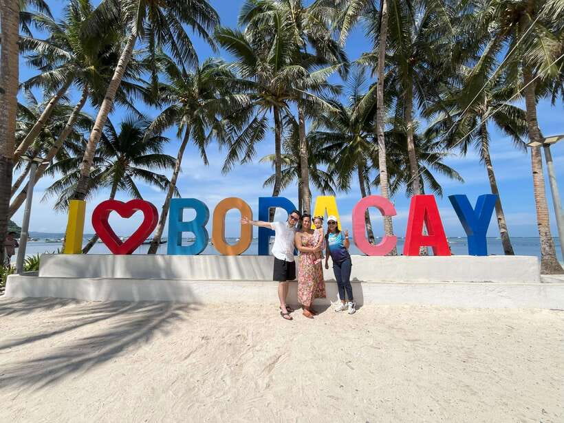 2-Hour Boracay Land Tour via Etrike - Puka Shell Beach: wooden signage, relax time, and optional paid photo extras