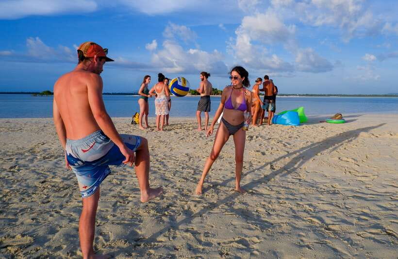 Bohol Virgin Island Sunset Tour - Virgin Island time: sunbathing, snacks near the shallows, and rocky shoreline views