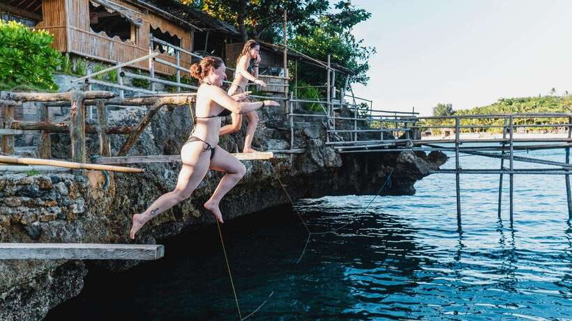Boracay: Island Hopping & Cliff Jumping by Haqqy Life - Snorkeling stop with guided marine viewing and a cash environmental fee