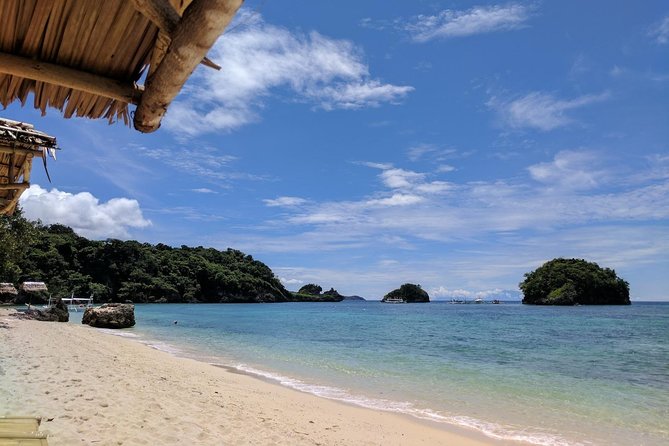 Boracay Island Hopping + Hot Kawa + Parasailing + Helmet Diving - Optional Crystal Cove and Magic Island add-ons, paid on the spot