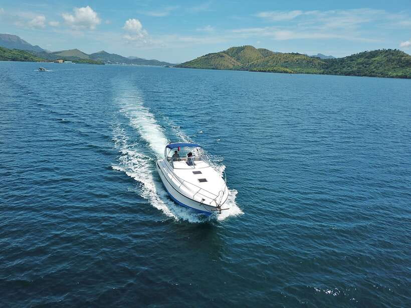 Coron: Private Island-Hopping Tour on a Yacht or Speedboat - Banol Beach and CYC Beach: golden sand, clear water, and real downtime