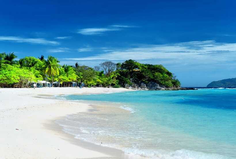 Coron Town: Coron Island Escapade Private Tour with Lunch - Banana Island: A Narrow Beach Against Hilly Forest Terrain