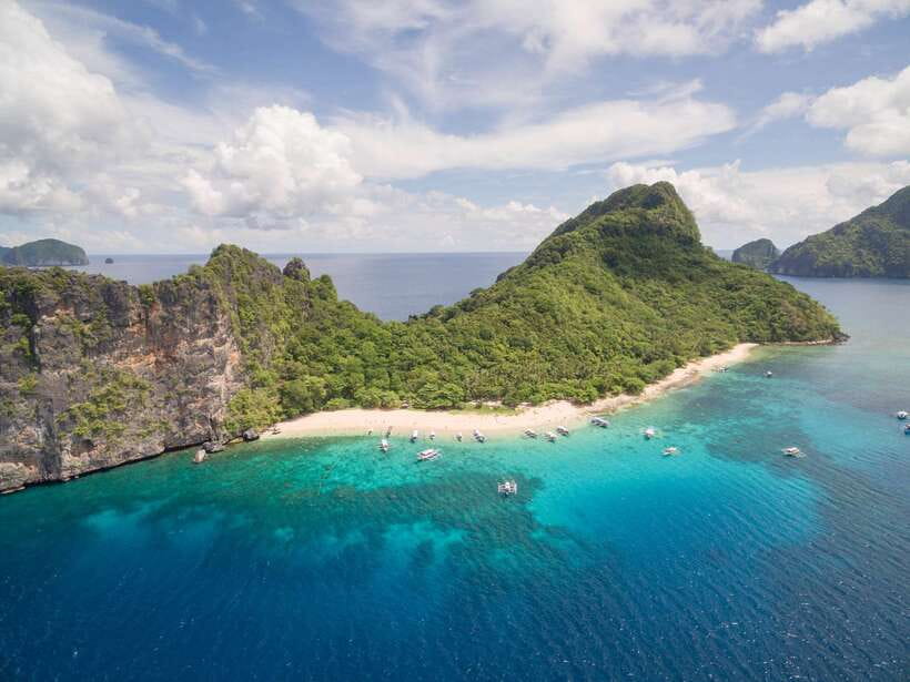 El Nido Island Hopping Tour C: Hidden Beaches & Shrine - Helicopter Island: the quick photo stop that turns into swim time