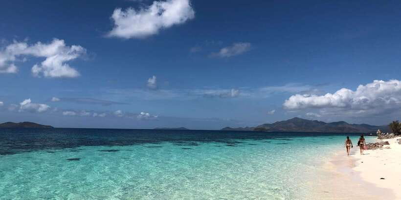 From Coron: Private Island-Hopping Cruise with Lunch - Swimming, corals, and what’s included versus what you should rent