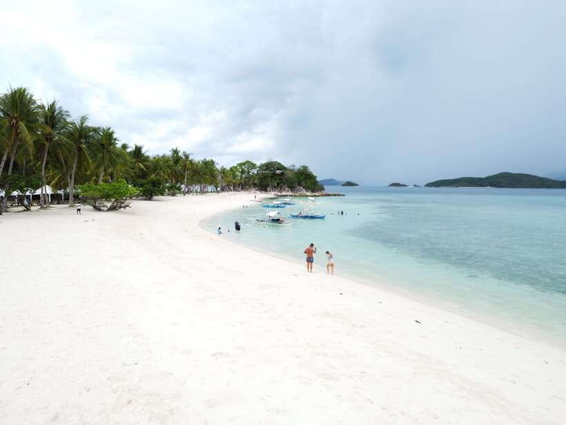 From Coron Town: Beaches and Islands Boat Tour with Lunch - Malcapuya Beach: the long white-sand stretch that feels like a smaller Boracay