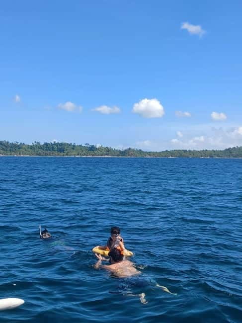 Port Barton: Island Hopping with Lunch,Hotel Transfer & Fees - Maxima Island beach: calm shoreline breaks and a smooth reset